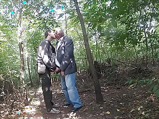 Elderly couple gets adventurous in the great outdoors, engaging in passionate lovemaking amidst nature's beauty.